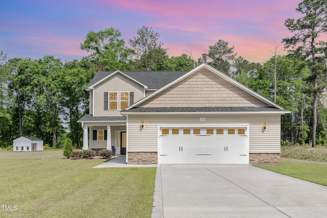 105 Forest Wood Dr, Salemburg, NC 28385 - craftsman house with driveway, covered porch, a lawn, and stone siding