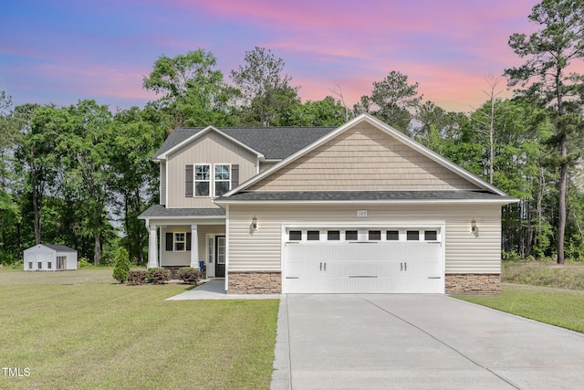 105 Forest Wood Dr, Salemburg, NC 28385 - craftsman-style home with a lawn, a garage, driveway, and stone siding