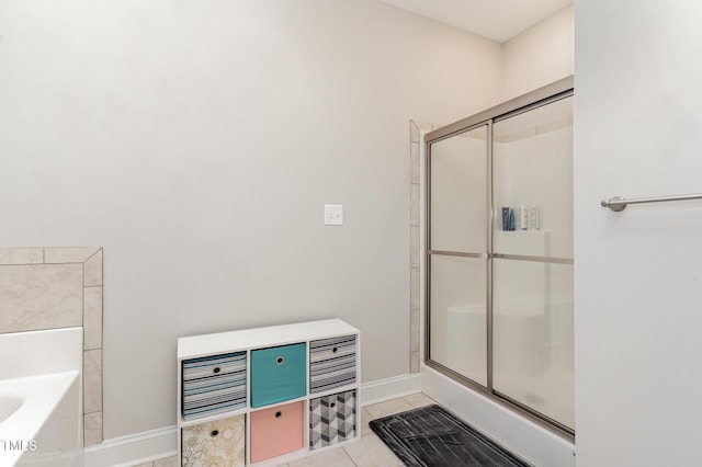 105 Forest Wood Dr, Salemburg, NC 28385 - full bathroom with baseboards, tile patterned floors, and a shower stall