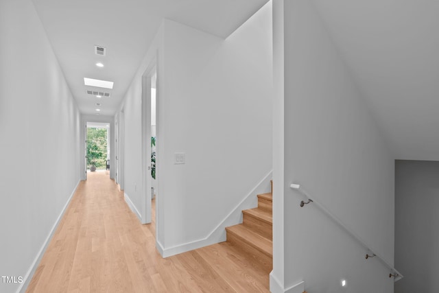 stairs featuring baseboards, wood finished floors, visible vents, and recessed lighting