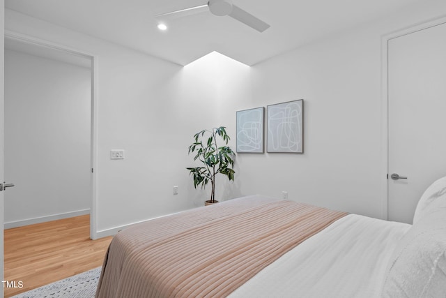 bedroom with baseboards, recessed lighting, ceiling fan, and light wood finished floors