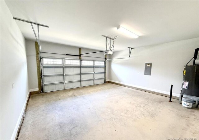 garage featuring baseboards, a garage door opener, water heater, and electric panel