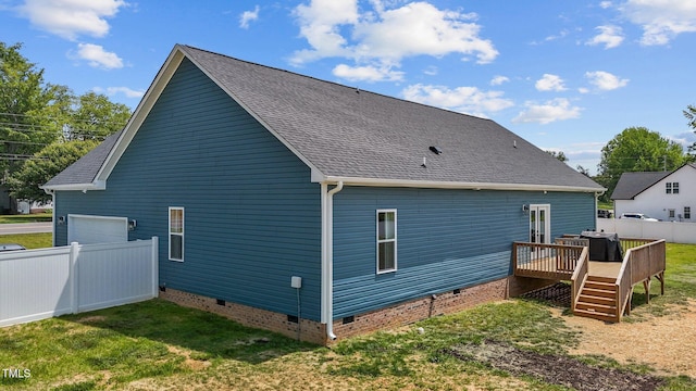 back of house featuring fence, a wooden deck, roof with shingles, and crawl space