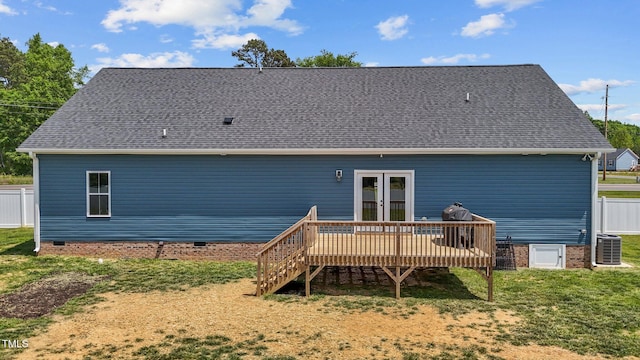 back of house featuring fence, a deck, cooling unit, crawl space, and a lawn