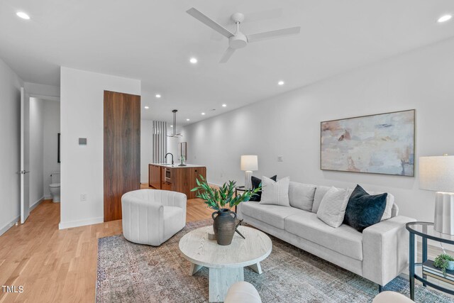 501 S Bloodworth St Unit 101, Raleigh, NC 27601 - living area featuring light wood-type flooring, a ceiling fan, baseboards, and recessed lighting