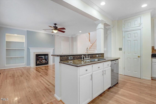 1480 Big Leaf Loop, Apex, NC 27502 - kitchen with dishwasher, a sink, dark stone countertops, a ceiling fan, and light wood-style flooring