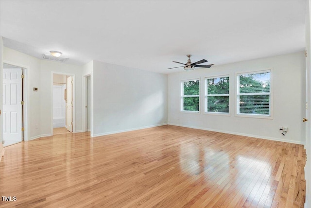 1480 Big Leaf Loop, Apex, NC 27502 - spare room with light wood-style flooring, a ceiling fan, and baseboards