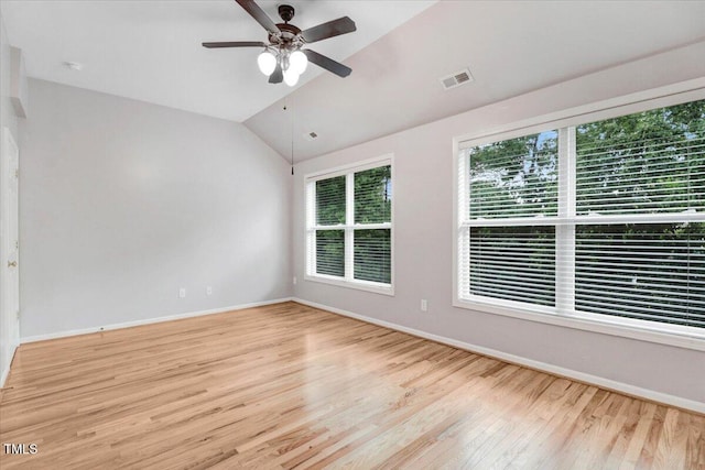1480 Big Leaf Loop, Apex, NC 27502 - unfurnished room with wood finished floors, baseboards, vaulted ceiling, and a ceiling fan