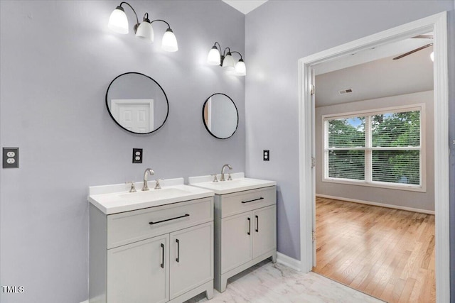 1480 Big Leaf Loop, Apex, NC 27502 - bathroom featuring two vanities and baseboards