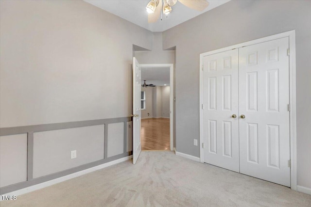 1480 Big Leaf Loop, Apex, NC 27502 - unfurnished bedroom featuring carpet floors, a closet, baseboards, and a ceiling fan