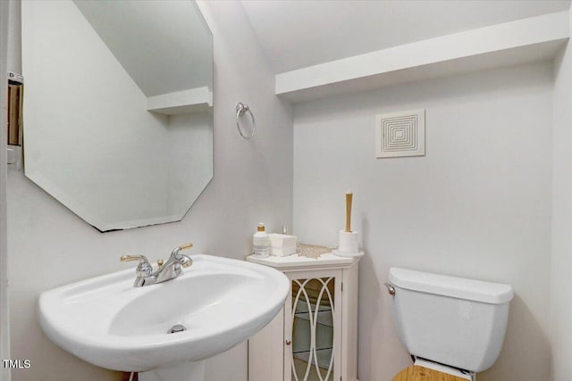 1480 Big Leaf Loop, Apex, NC 27502 - bathroom featuring a sink, vaulted ceiling, and toilet