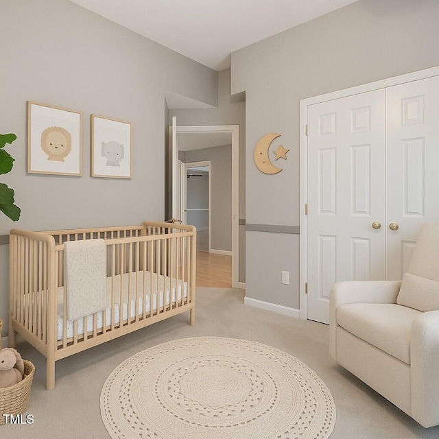 1480 Big Leaf Loop, Apex, NC 27502 - bedroom with light carpet, a crib, baseboards, and a closet