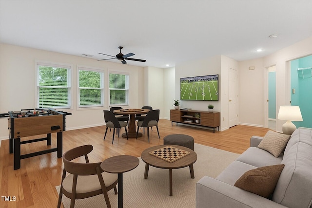 1480 Big Leaf Loop, Apex, NC 27502 - living area with light wood finished floors, ceiling fan, recessed lighting, and baseboards