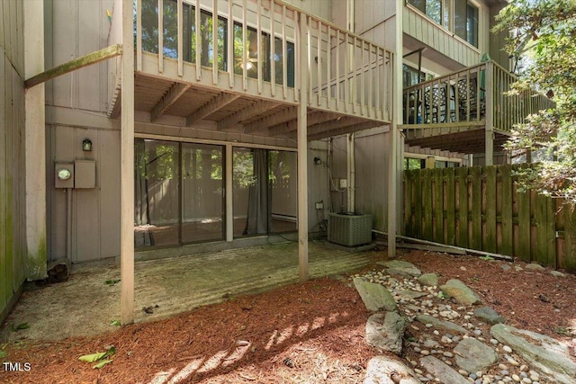 view of patio / terrace with central AC and fence