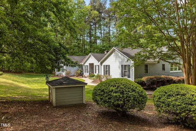 113 Denard St, Oxford, NC 27565 - view of front of property with a chimney and a front yard