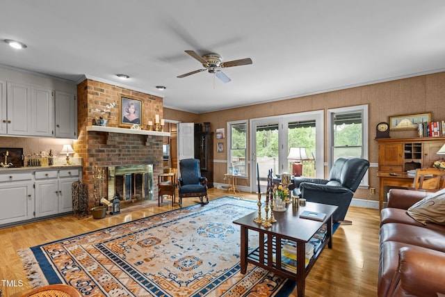 113 Denard St, Oxford, NC 27565 - living area featuring crown molding, a fireplace, ceiling fan, and light wood-style floors