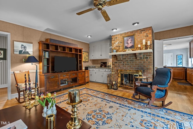 113 Denard St, Oxford, NC 27565 - living room featuring ceiling fan, crown molding, a fireplace, and light wood finished floors