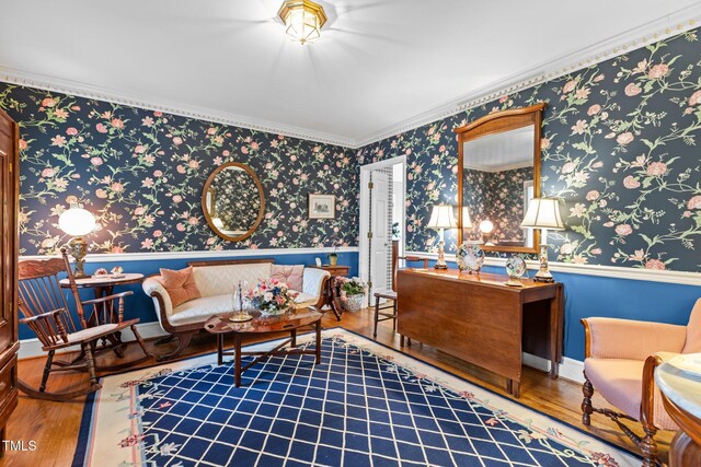 113 Denard St, Oxford, NC 27565 - living room featuring crown molding, wallpapered walls, hardwood / wood-style floors, and wainscoting