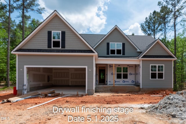 craftsman-style home featuring a porch and an attached garage