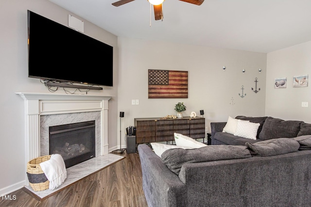 420 Cherry St, Fuquay Varina, NC 27526 - living area with dark wood-type flooring, a ceiling fan, baseboards, and a fireplace