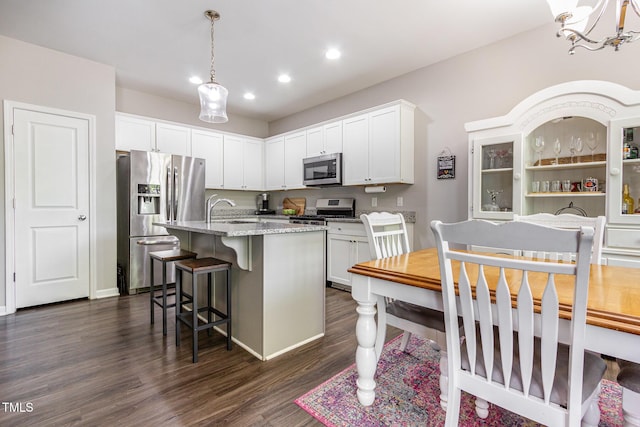 420 Cherry St, Fuquay Varina, NC 27526 - kitchen featuring dark wood finished floors, a sink, stainless steel appliances, recessed lighting, and white cabinetry
