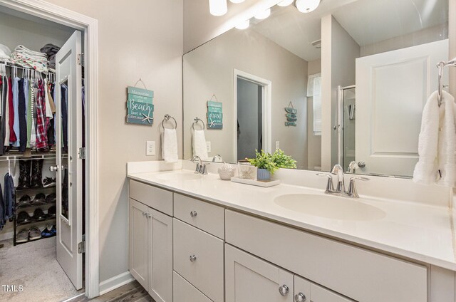 420 Cherry St, Fuquay Varina, NC 27526 - full bath featuring a sink, a shower stall, double vanity, and a spacious closet