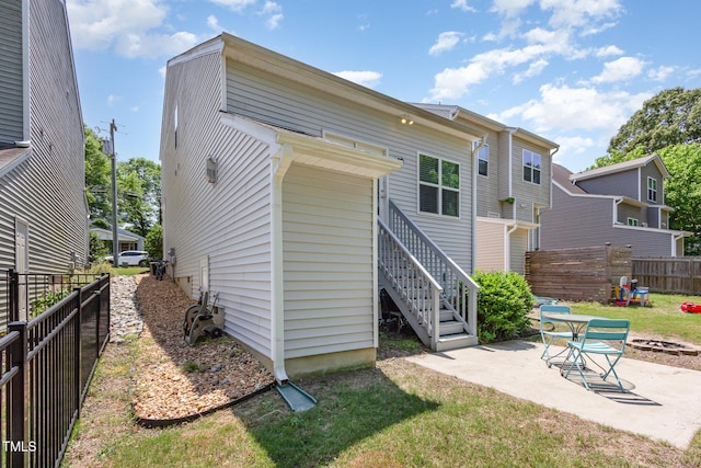 420 Cherry St, Fuquay Varina, NC 27526 - rear view of house with stairway, a patio, a yard, and fence