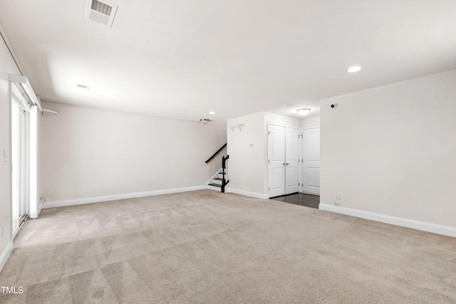 1101 Boxcar Way, Apex, NC 27502 - unfurnished living room with carpet, stairway, recessed lighting, and baseboards