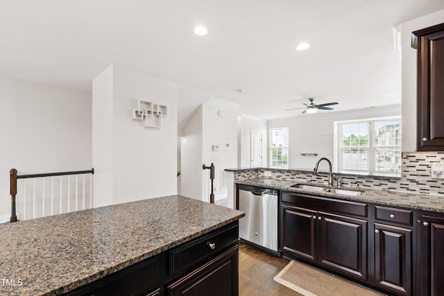 1101 Boxcar Way, Apex, NC 27502 - kitchen with dishwasher, a sink, decorative backsplash, a ceiling fan, and dark wood-type flooring