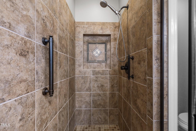 full bath with a stall shower and toilet