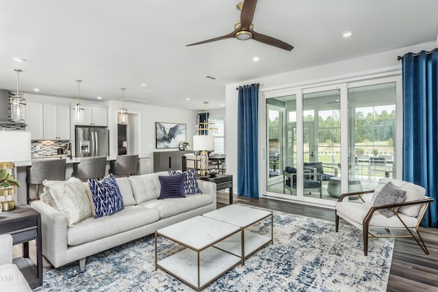 living area with dark wood-style floors, recessed lighting, and ceiling fan