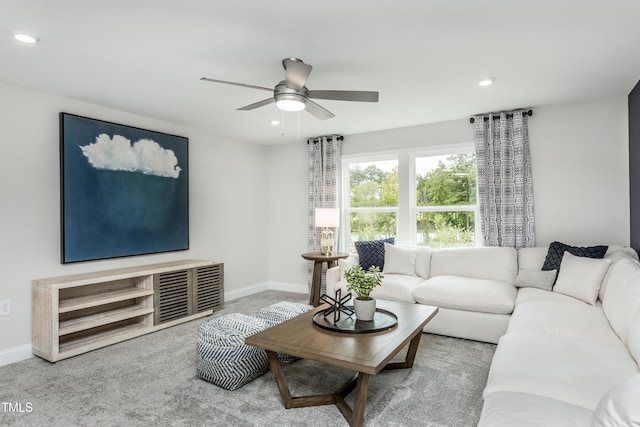 carpeted living room featuring baseboards, recessed lighting, and a ceiling fan