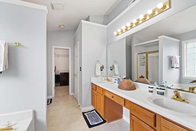 full bath with a shower stall, a bath, double vanity, a walk in closet, and tile patterned floors
