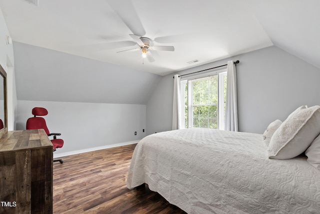 bedroom featuring vaulted ceiling, wood finished floors, baseboards, and a ceiling fan