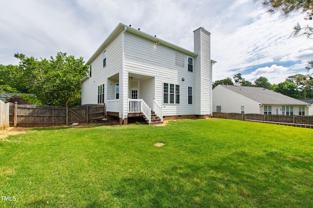 rear view of property with a chimney and crawl space