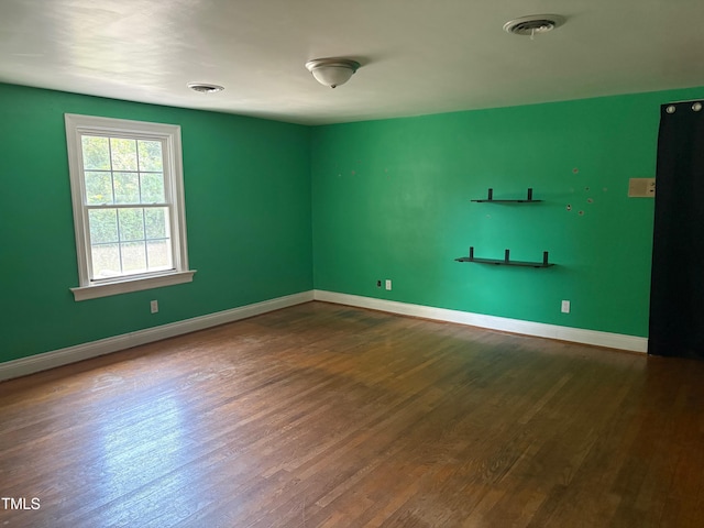 119 Watson St, Enfield, NC 27823 - empty room featuring dark wood finished floors and baseboards