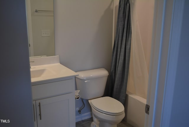full bathroom featuring vanity, shower / bath combo with shower curtain, and toilet