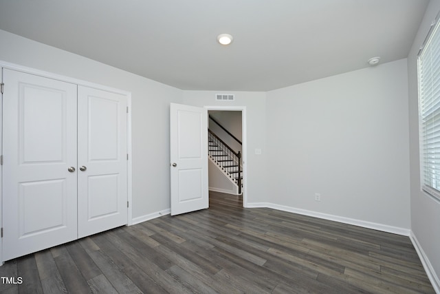 2401 Laurel Valley Way, Raleigh, NC 27604 - unfurnished bedroom featuring dark wood-style flooring, baseboards, a closet, and recessed lighting
