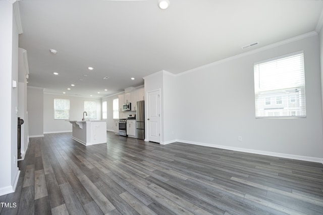 2401 Laurel Valley Way, Raleigh, NC 27604 - unfurnished living room with dark wood-style floors, ornamental molding, recessed lighting, baseboards, and a sink