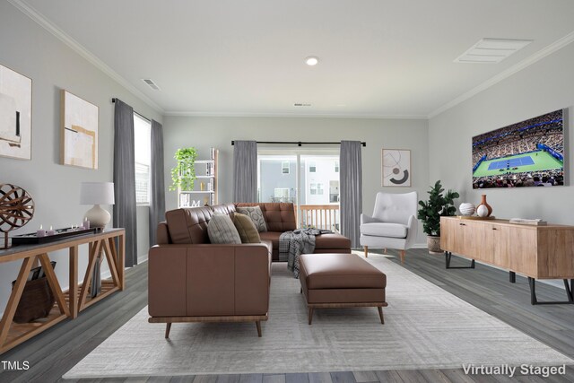 2401 Laurel Valley Way, Raleigh, NC 27604 - living area featuring plenty of natural light, ornamental molding, wood finished floors, and baseboards