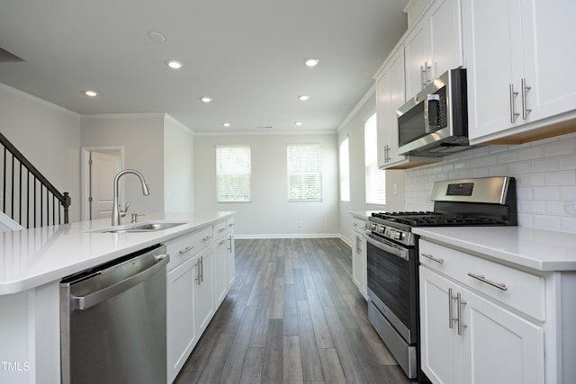 2401 Laurel Valley Way, Raleigh, NC 27604 - kitchen featuring appliances with stainless steel finishes, a sink, ornamental molding, recessed lighting, and plenty of natural light