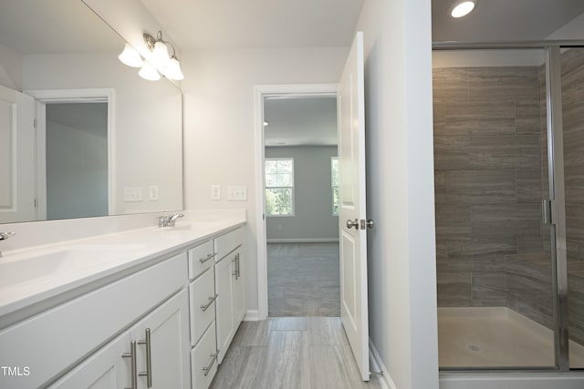 2401 Laurel Valley Way, Raleigh, NC 27604 - bathroom with a shower stall, double vanity, and baseboards
