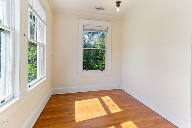 1308-10 Wake Forest Rd, Raleigh, NC 27604 - empty room featuring crown molding, wood finished floors, and baseboards