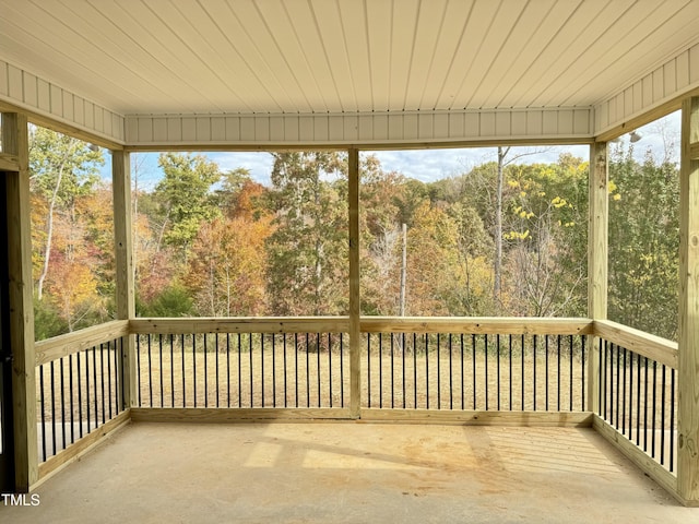 unfurnished sunroom with a wealth of natural light