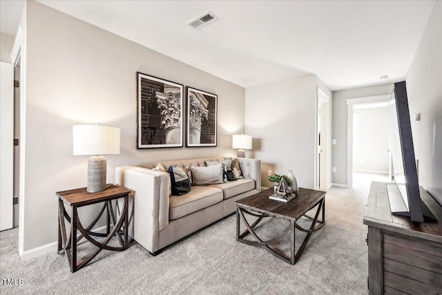 living room with visible vents, baseboards, and carpet floors