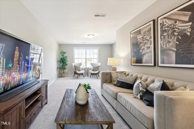 living room featuring carpet, visible vents, and baseboards