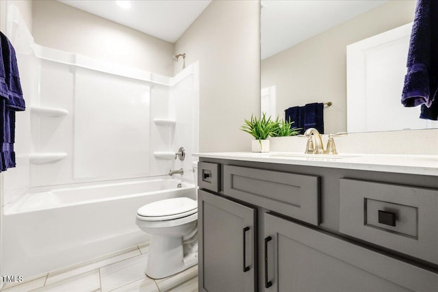 bathroom with toilet, bathtub / shower combination, and vanity