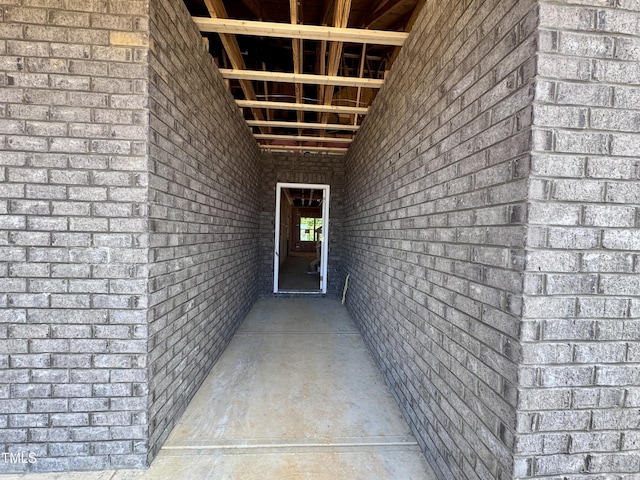 property entrance with brick siding