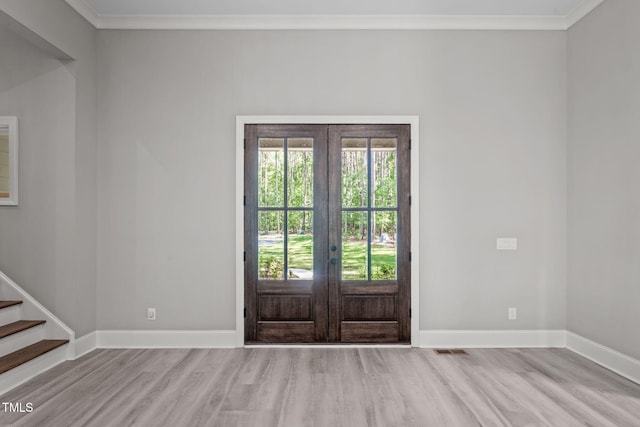 59 Mill Rd, Pittsboro, NC 27312 - entrance foyer with french doors, wood finished floors, baseboards, ornamental molding, and stairs