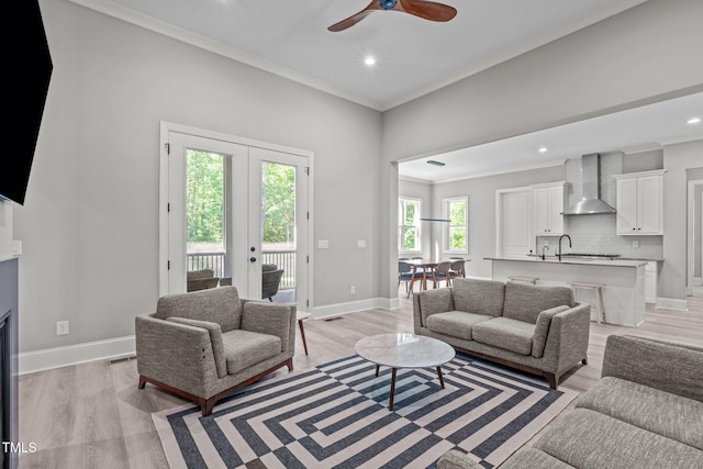 59 Mill Rd, Pittsboro, NC 27312 - living area featuring ornamental molding, a ceiling fan, light wood-style flooring, recessed lighting, and french doors